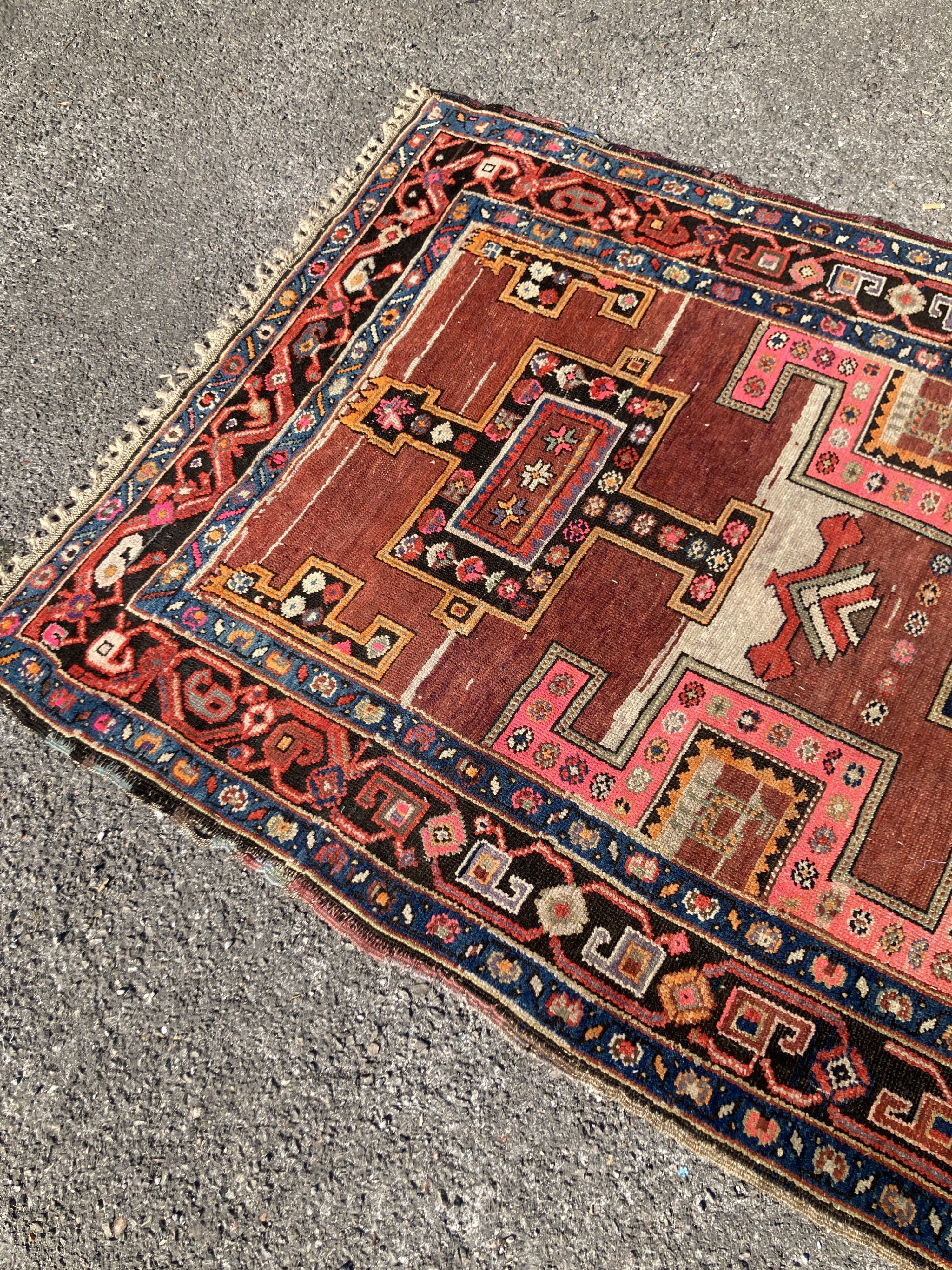 An early 20th century Caucasian Kazak hall carpet, 370 x 128cm